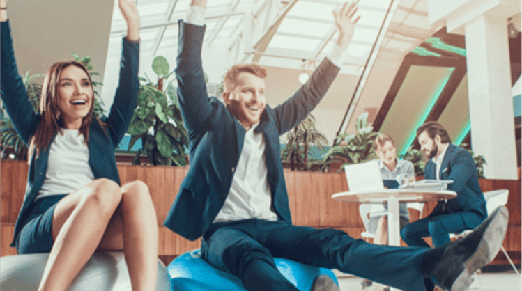 male-and-female-coworkers-in-office-medicine-ball-exercise